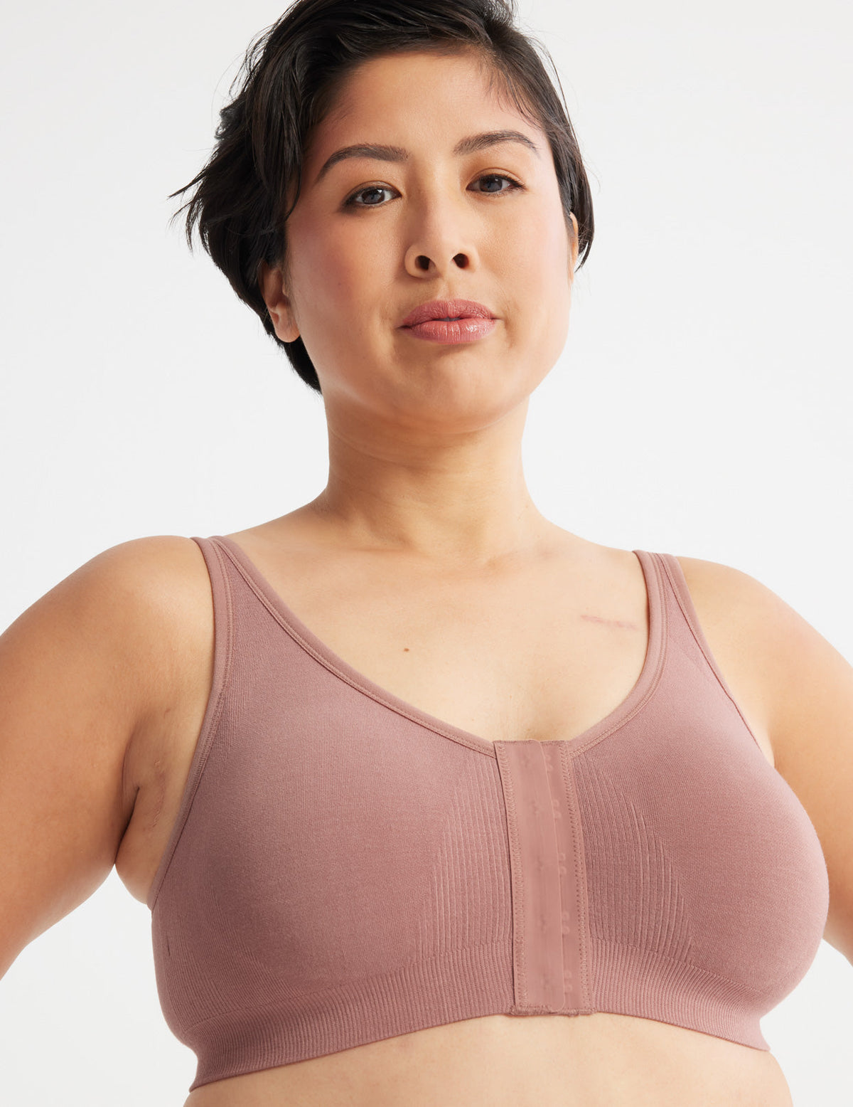 Front view of model wearing the Ultra Soft Front Closure Bra, highlighting the neckline, easy front closure, and seamless knit silhouette – Bisque – view 2 of 13