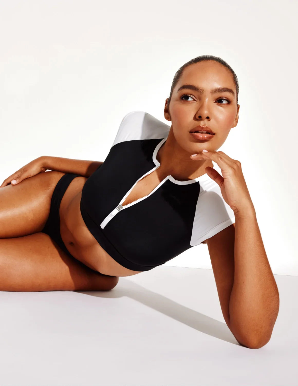 Front view of model wearing the Leakproof Sculpt Bikini Swim Bottom highlighting the coverage and fit – Black – view 9 of 14