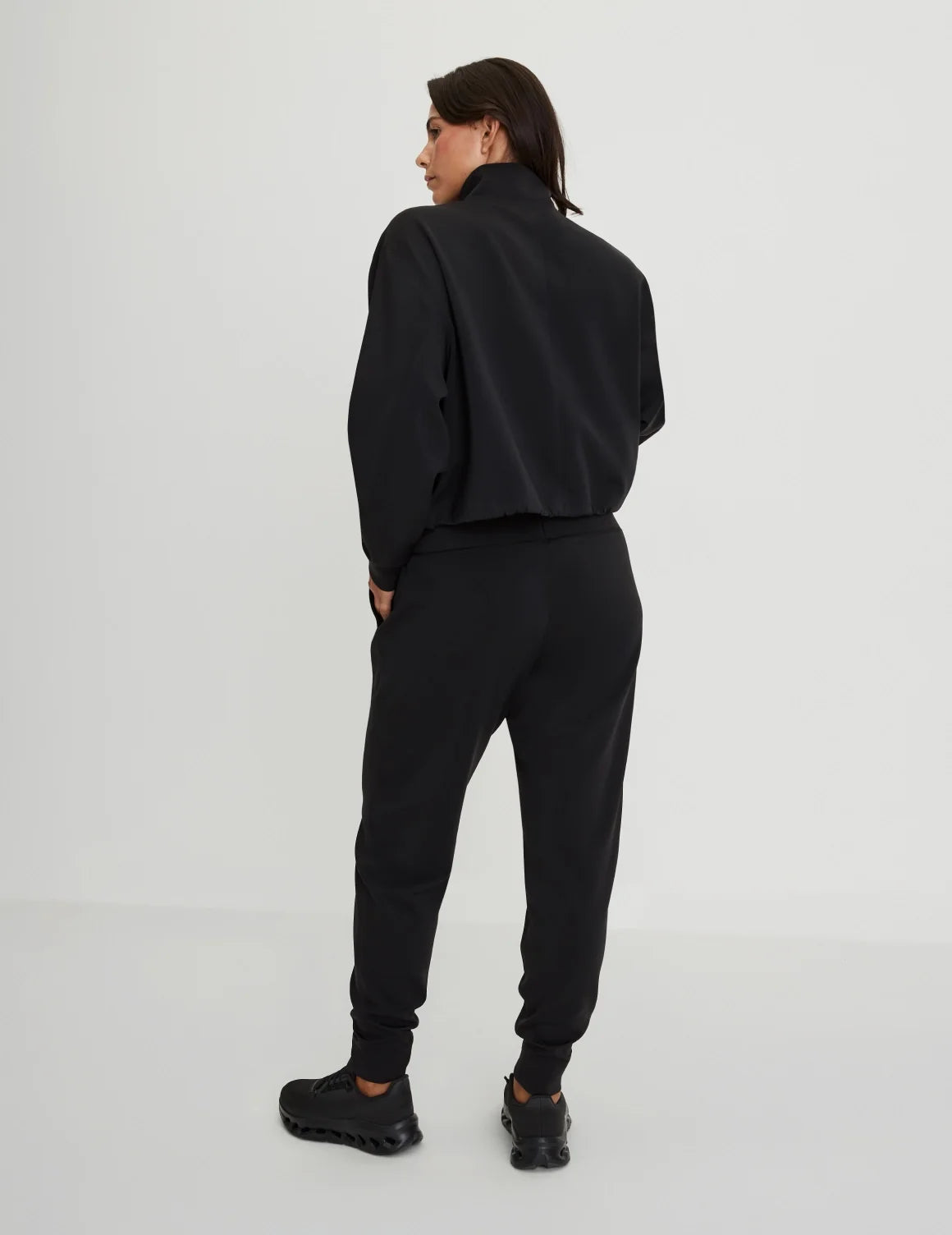 Back view of model wearing the CloudCut™ Jogger highlighting the coverage and fit – Black – view 3 of 23