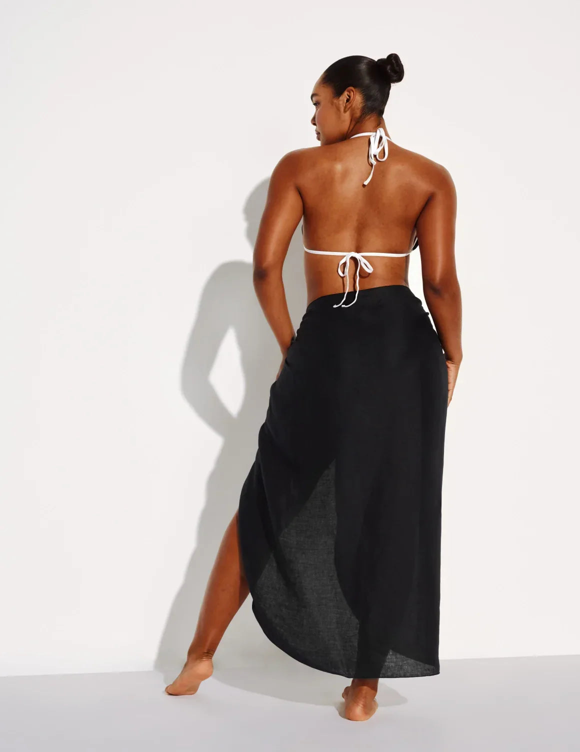 Back view of model wearing the Crinkle Linen Sarong highlighting the coverage and fit – Black – view 6 of 13