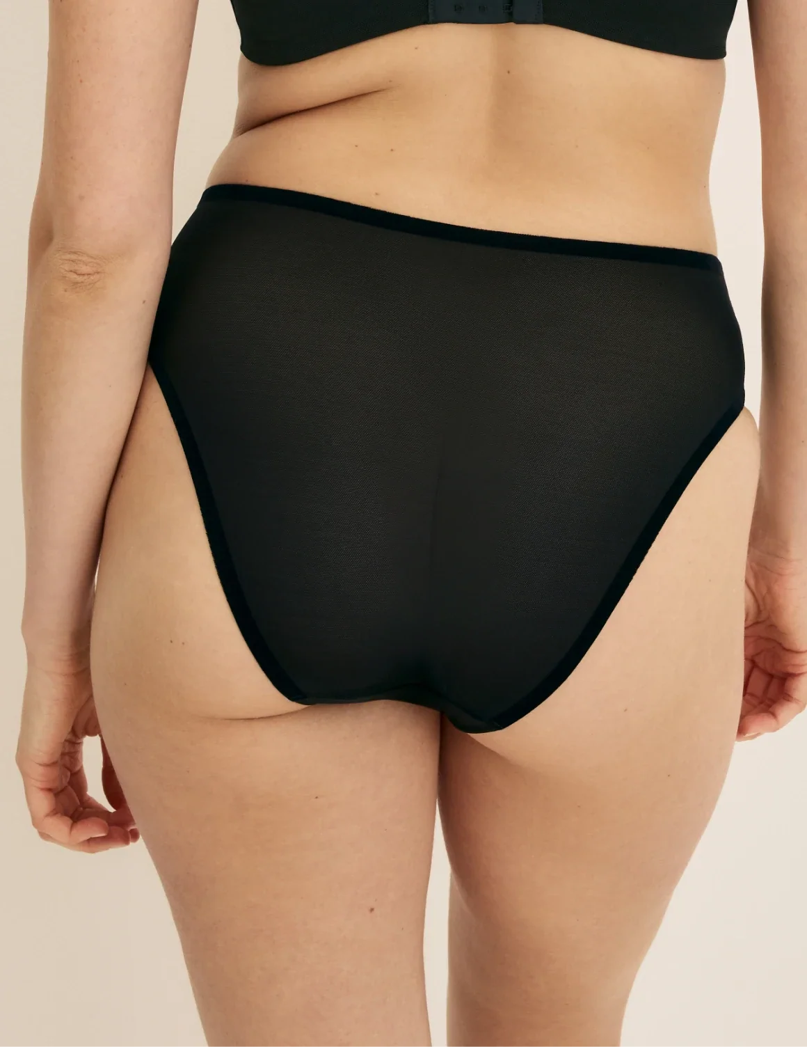 Back view of model wearing the Essential Full Mesh French Cut highlighting the coverage and smooth fit – Black – view 7 of 13