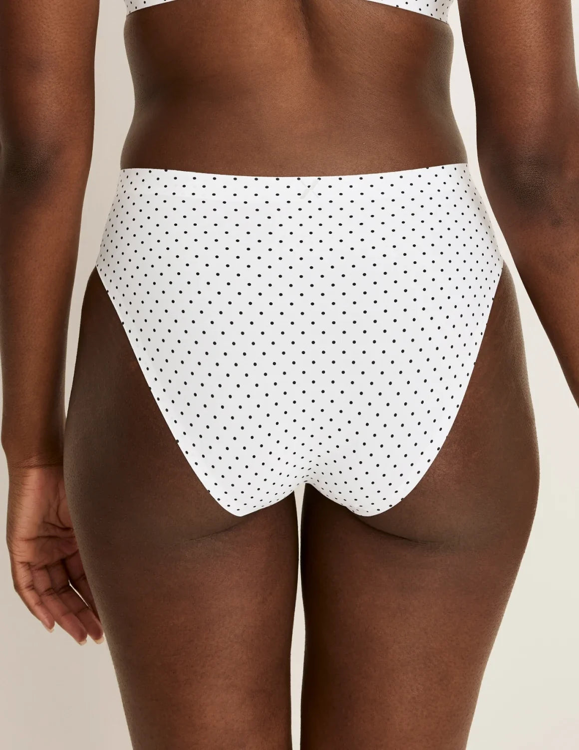 Back view of model wearing the Essential No-Show French Cut highlighting the coverage and smooth fit – White with Black Polka Dot – view 11 of 30