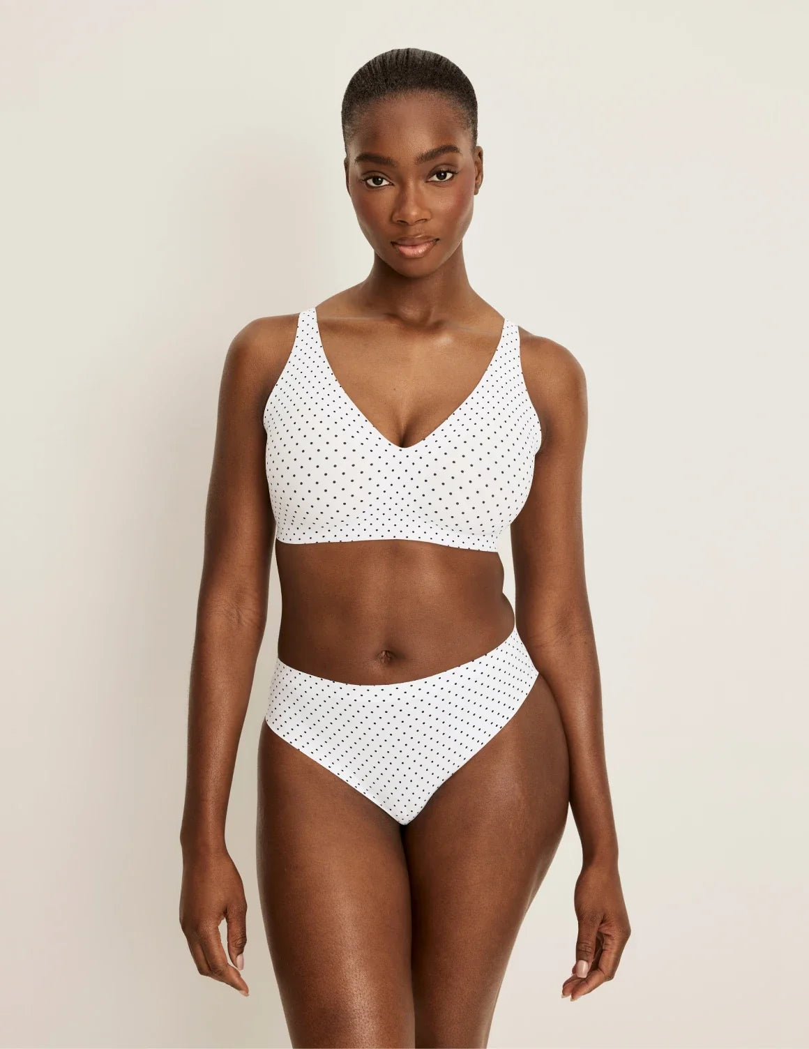 Full-body view of model wearing the Essential No-Show French Cut highlighting the coverage and smooth fit – White with Black Polka Dot – view 12 of 30