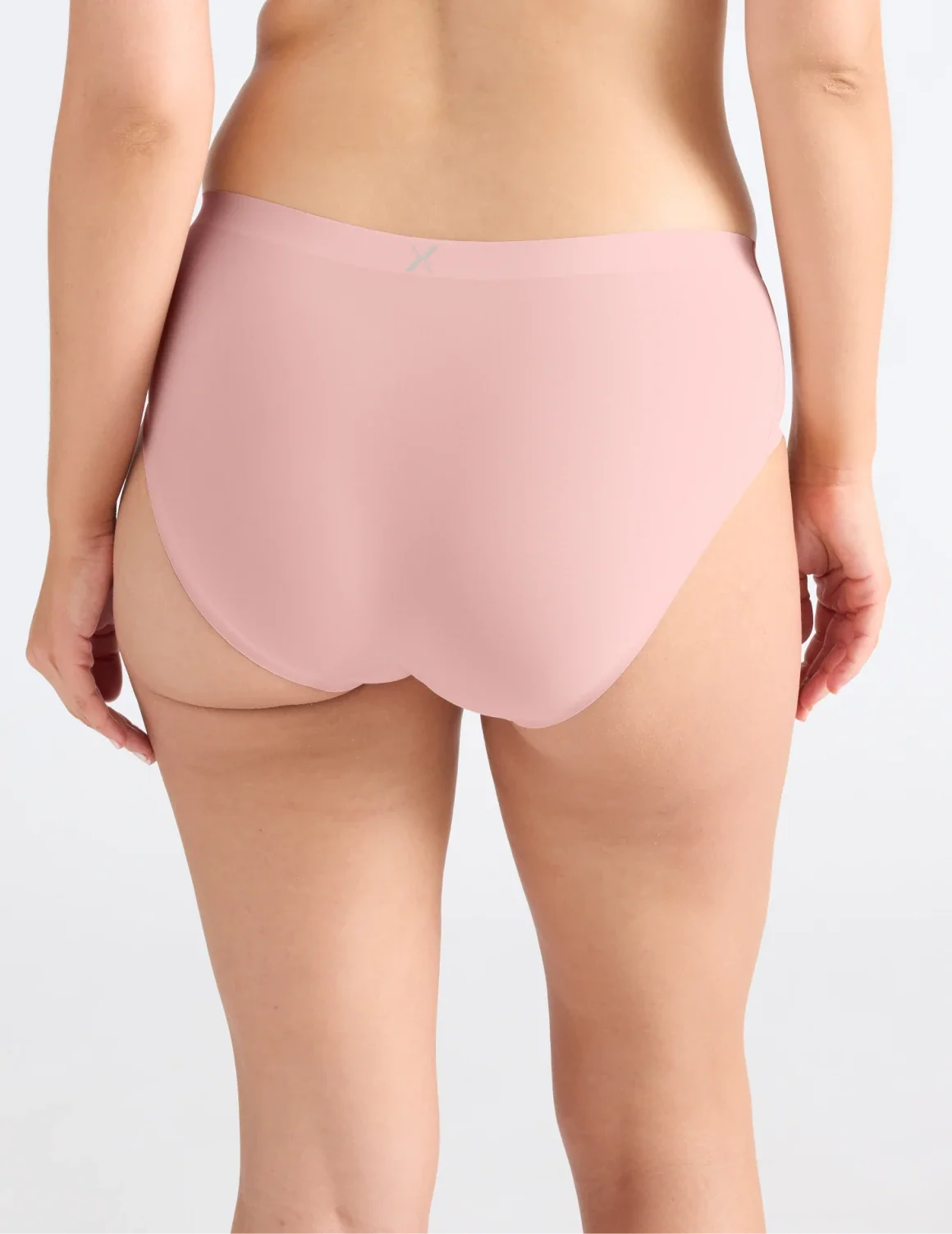 Back view of model wearing the Essential No-Show Boyshort highlighting the coverage and smooth fit – Rose Water – view 10 of 27