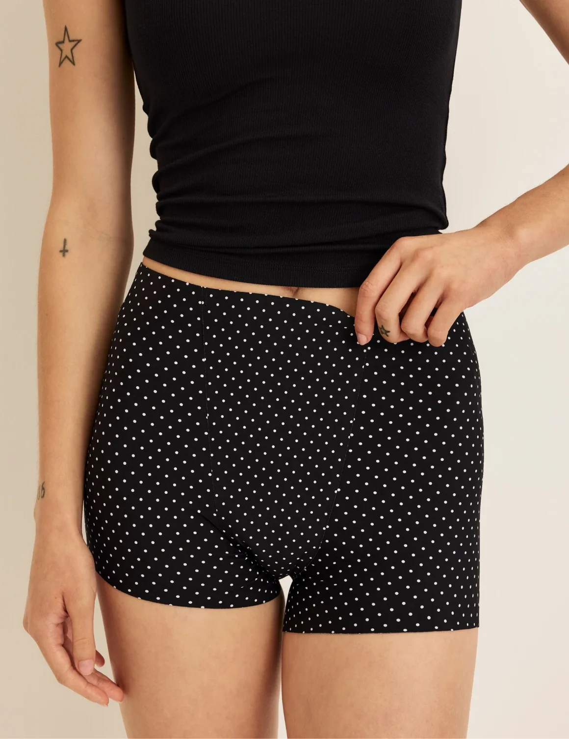 Front view of model wearing the SuperPlus Leakproof® Dream Short highlighting the coverage and smooth fit – Black with White Polka Dot – view 8 of 36
