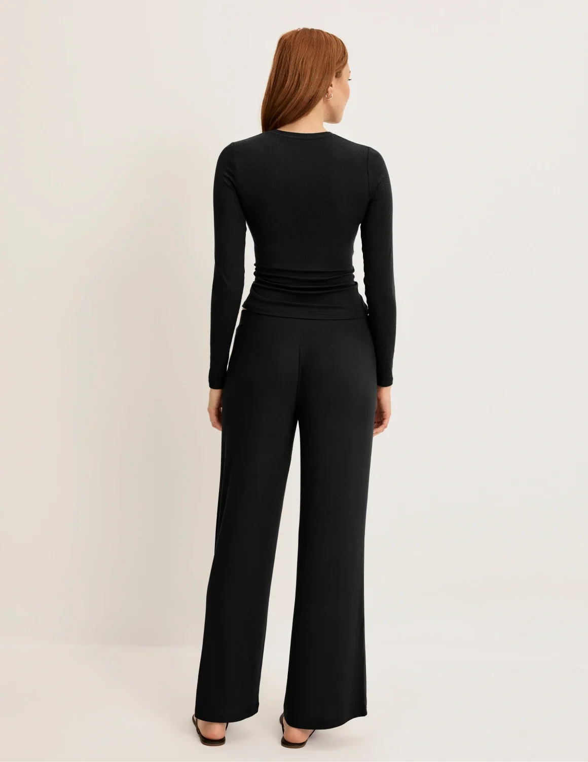 Front view of model wearing the Modal Rib Pant highlighting the coverage and fit – Black – view 3 of 13