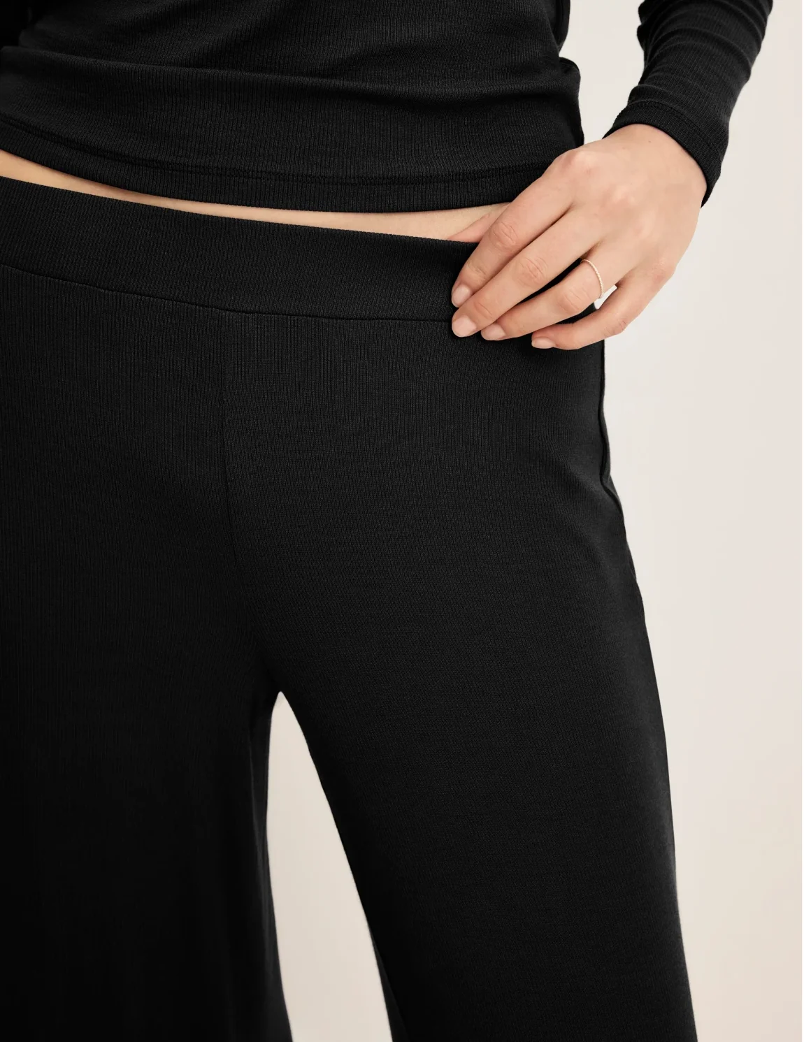 Front view of model wearing the Modal Rib Pant highlighting the coverage and fit – Black – view 4 of 13