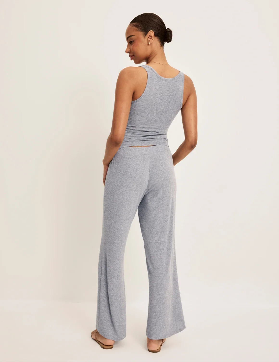 Back view of model wearing the Modal Rib Pant highlighting the coverage and fit – Heathered Grey – view 7 of 13