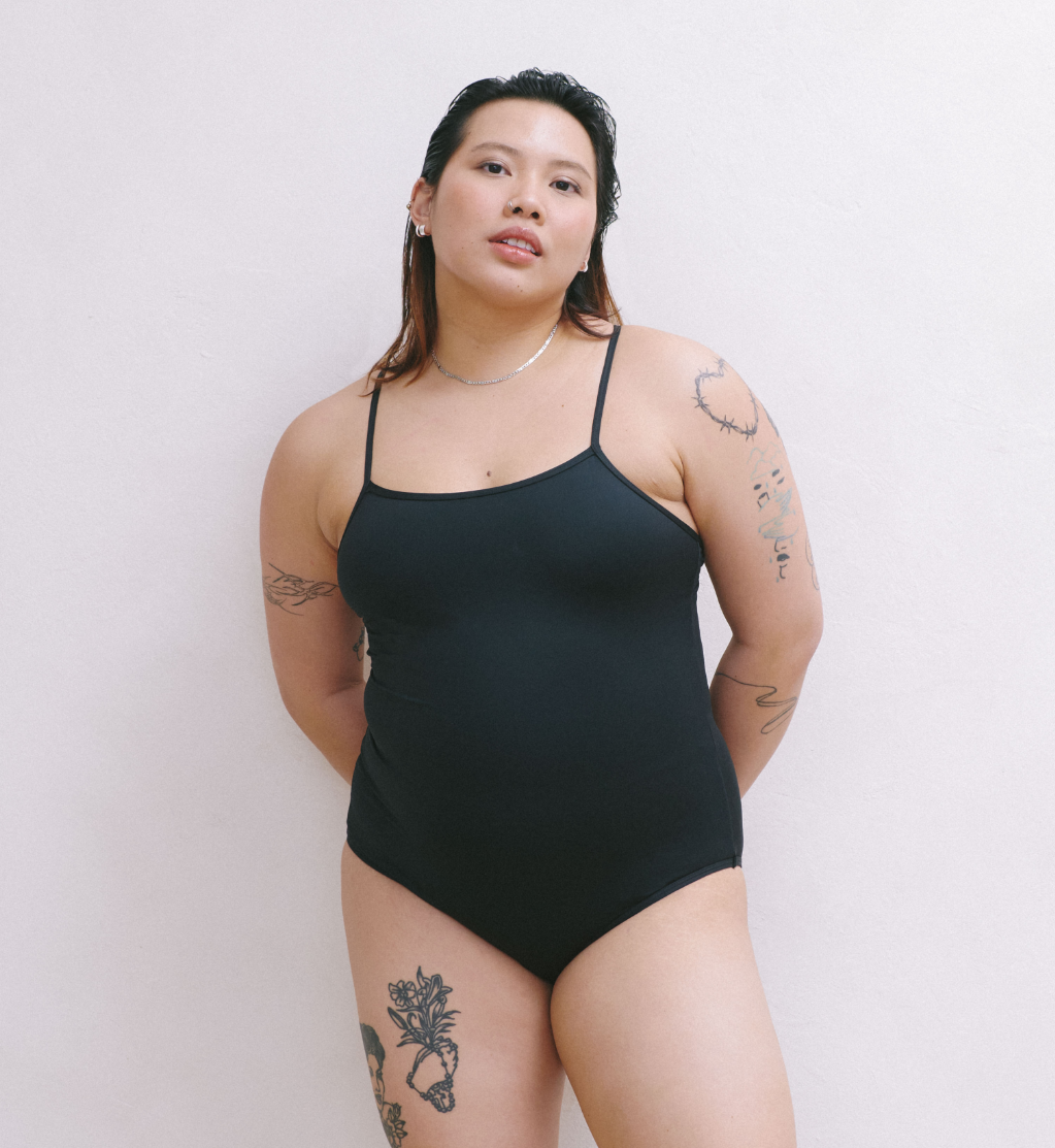 Front view of model wearing the Teen Period Swim Freestyle One-Piece highlighting the coverage and fit – Black – view 6 of 37