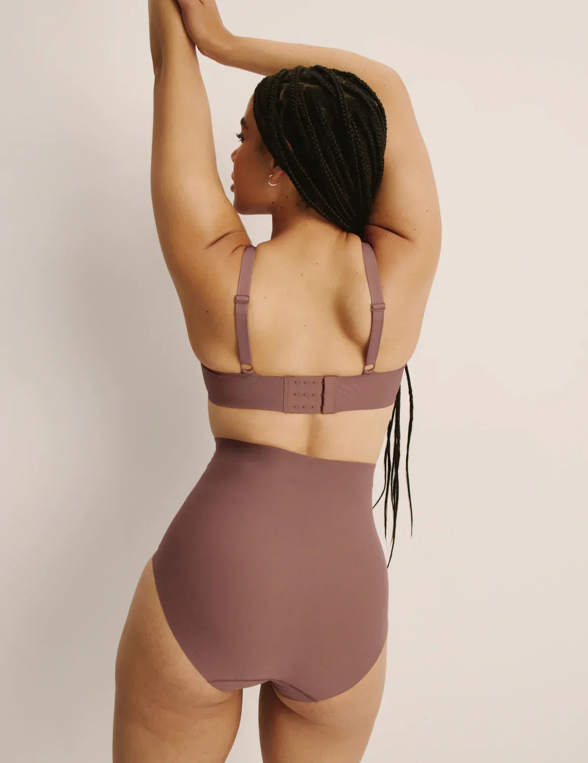 Back view of model wearing the Shaper High Rise Briefs, highlighting the coverage and smooth fit – Sola – view 8 of 12