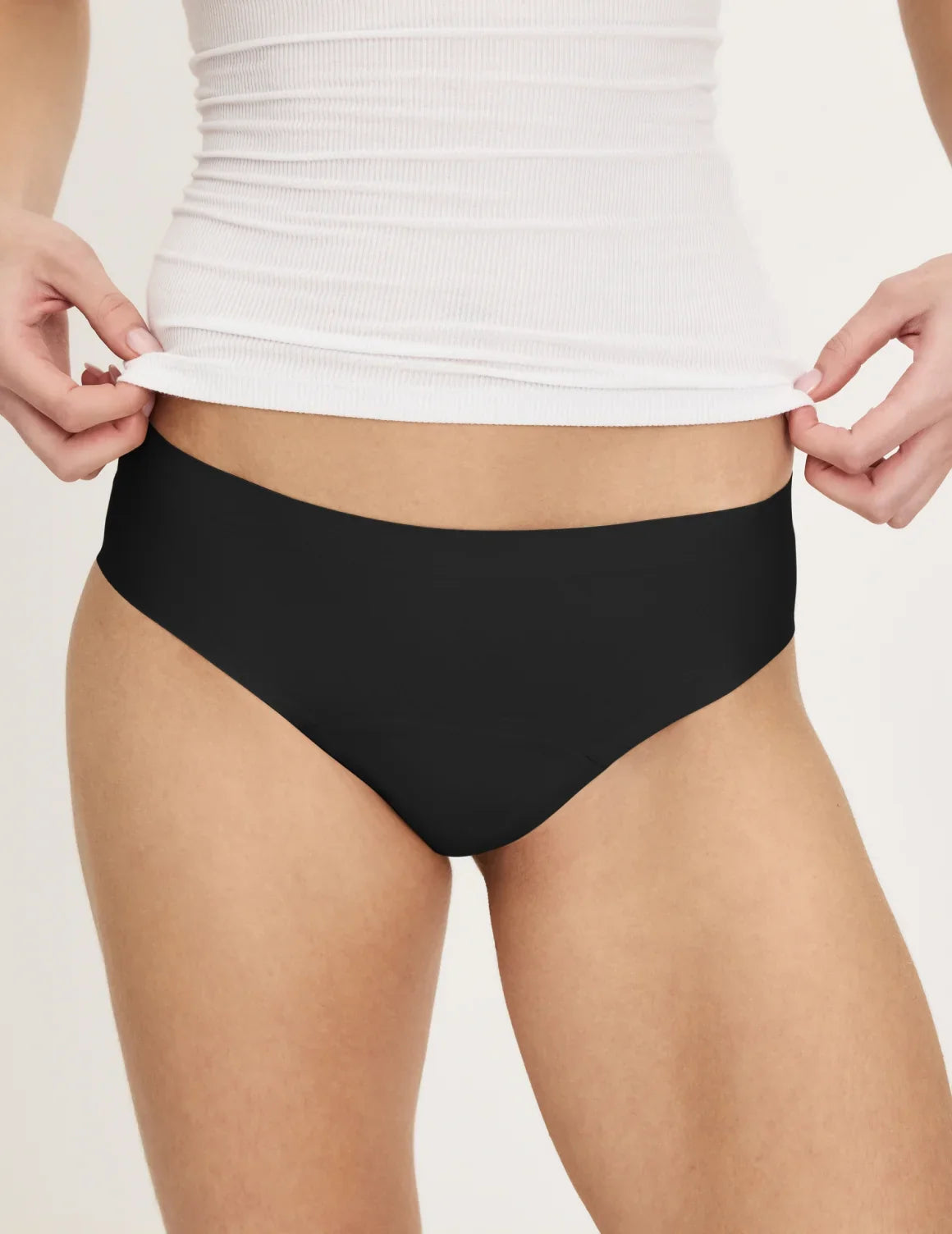 Front view of model wearing the Teen Super Leakproof® No-Show Bikini highlighting the coverage and smooth fit – Black – view 4 of 49