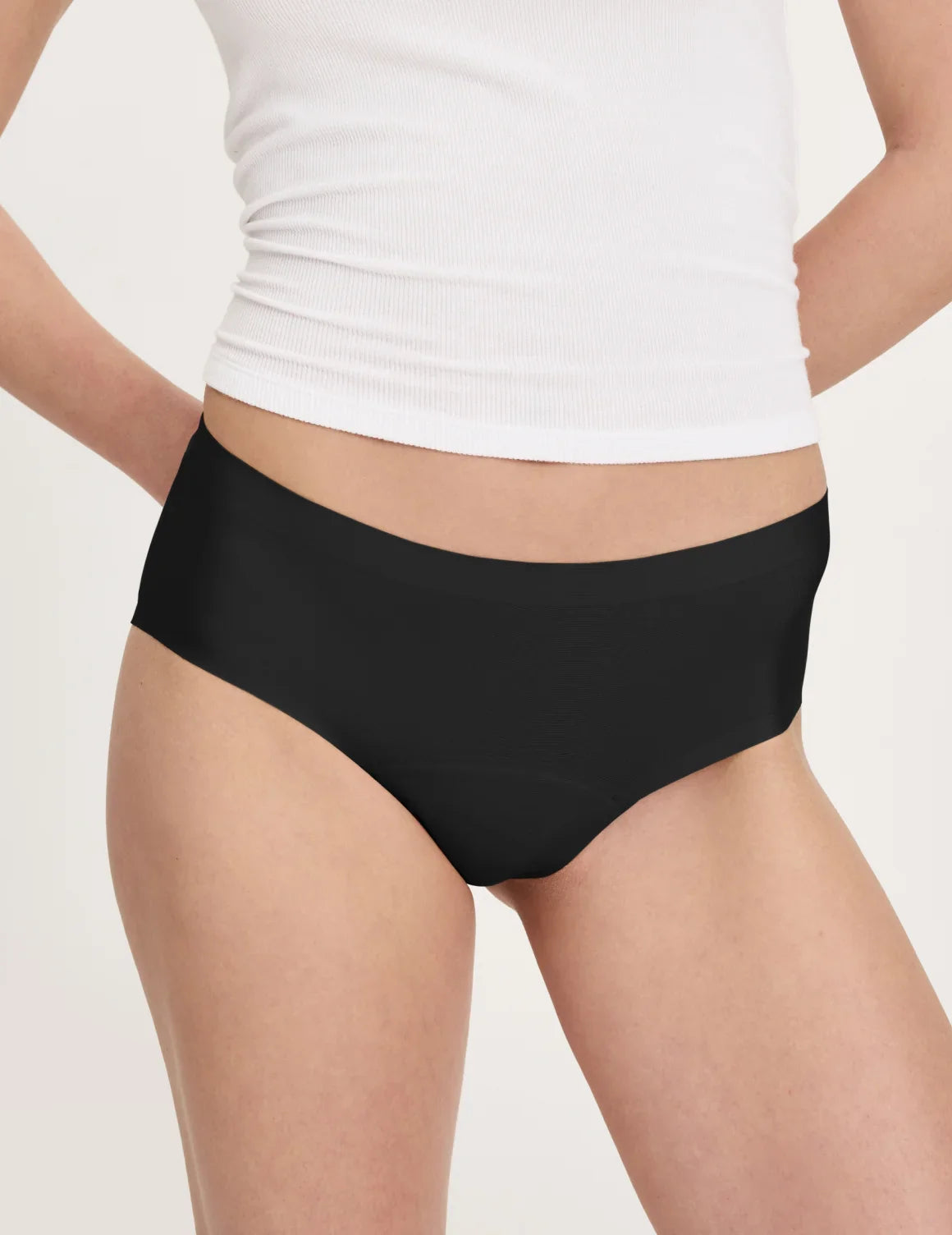 Front view of model wearing the Teen Super Leakproof® No-Show Boyshort highlighting the coverage and smooth fit – Black – view 3 of 29