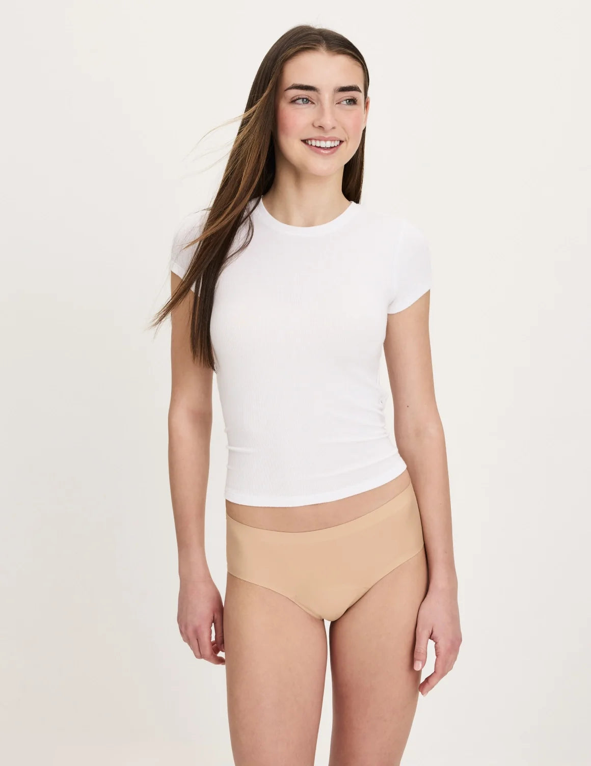 Front view of model wearing the Teen Super Leakproof® No-Show Boyshort highlighting the coverage and smooth fit – Warm Sand – view 9 of 48