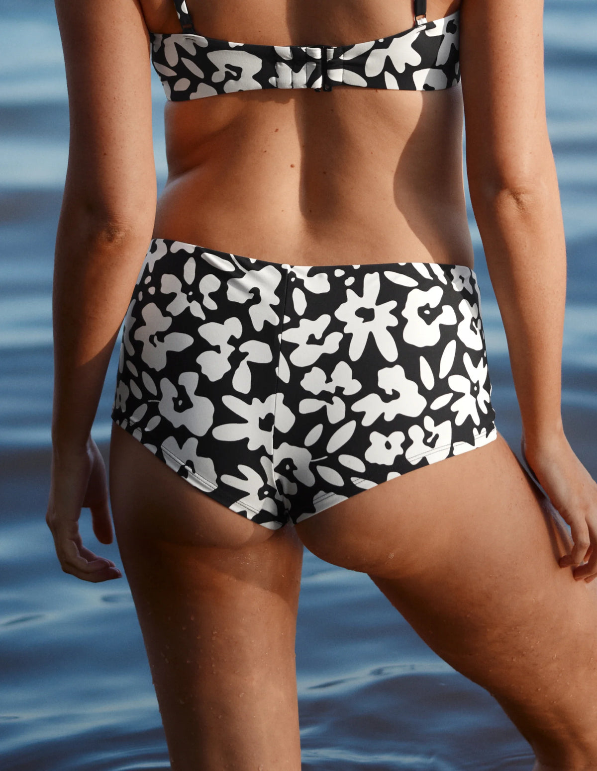 Back view of model wearing the Sculpt Cheeky Low Rise Swim Bottom highlighting the coverage and fit – Jasmine Dusk – view 11 of 12