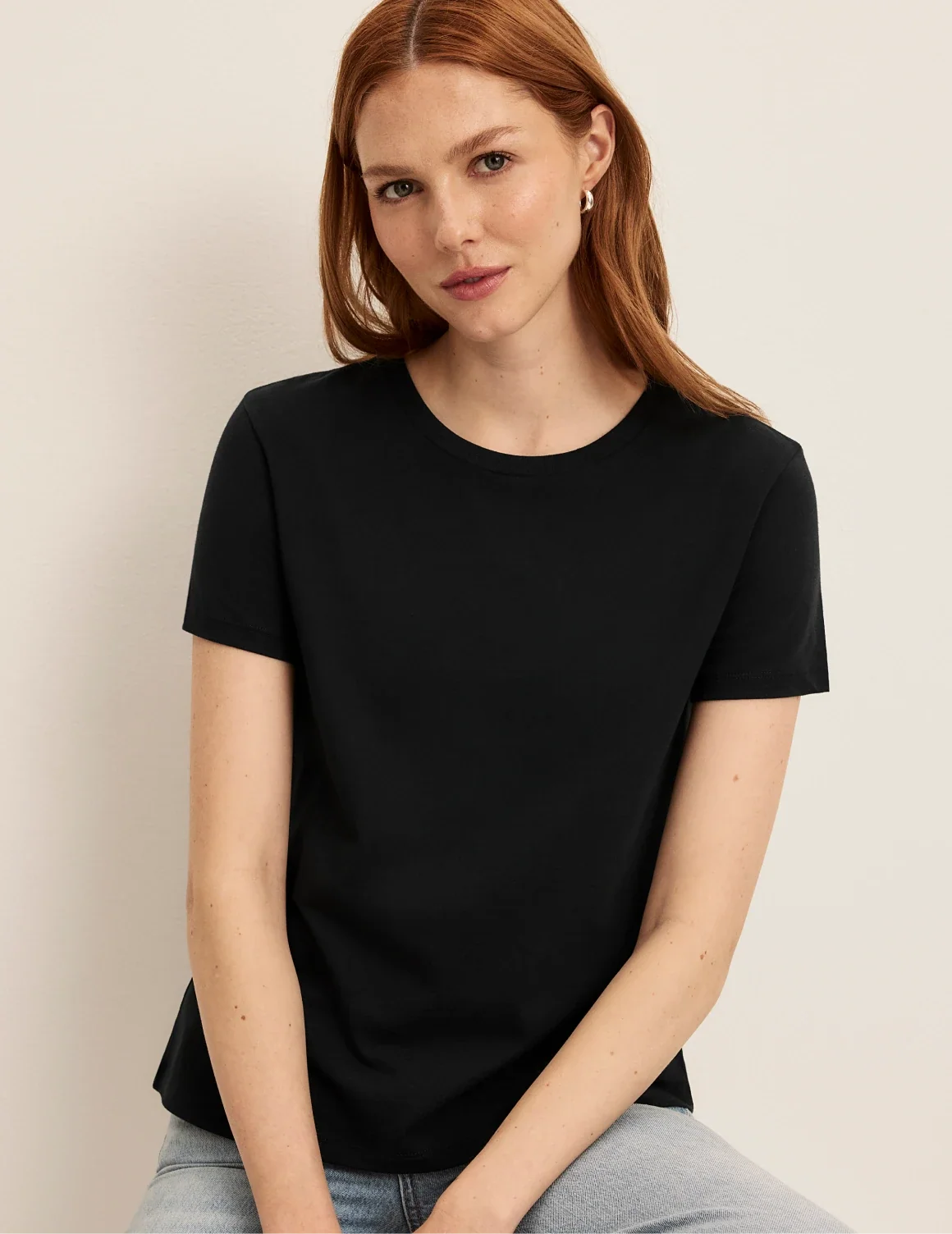 Front view of model wearing the Cotton Relaxed T-Shirt highlighting the coverage and fit – Black – view 9 of 20