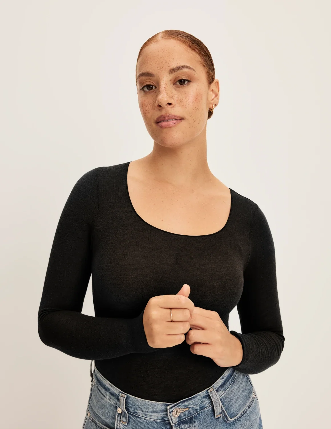 Front view of model wearing the Cashmere Mist Scoop Top highlighting the neckline and fit – Black – view 1 of 17