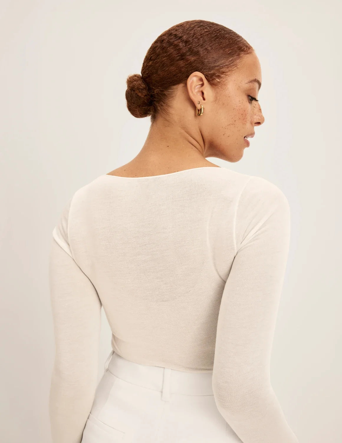 Back view of model wearing the Cashmere Mist Scoop Top highlighting the neckline and fit – Ivory – view 9 of 17