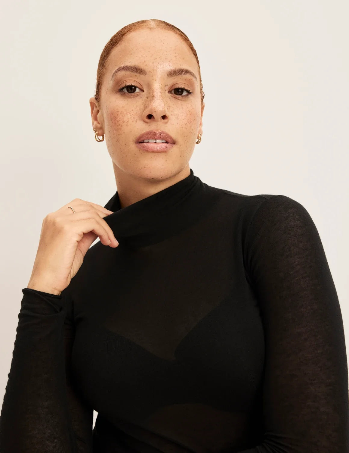 Front view of model wearing the Cashmere Mist Turtleneck highlighting the neckline and fit – Black – view 8 of 9