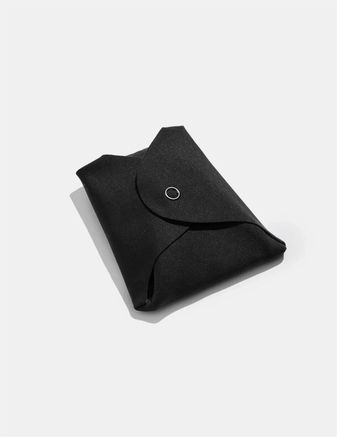 Teen Super Leakproof Reusable Snap Pads shown front-facing against a light gray background – Black – view 3 of 5