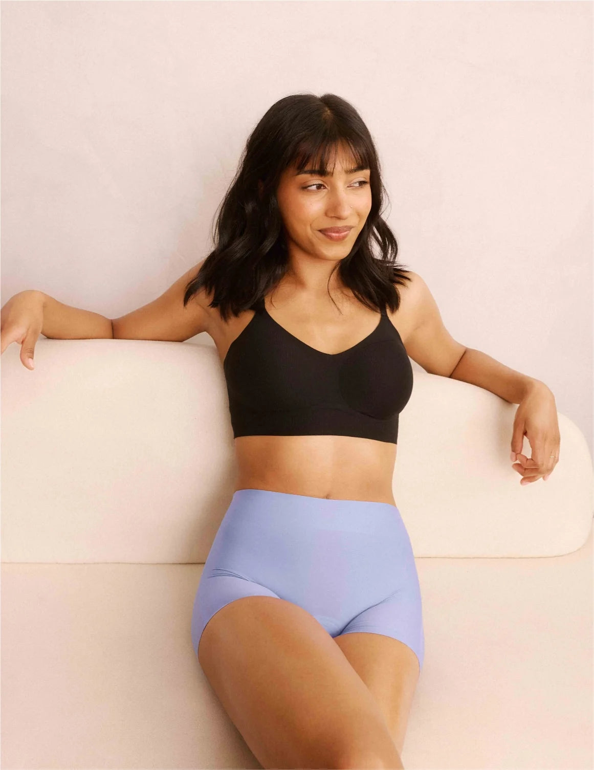 Front view of model wearing the Teen On-The-Daily Bra, highlighting the neckline, pullover design, and silhouette – Black – view 6 of 16