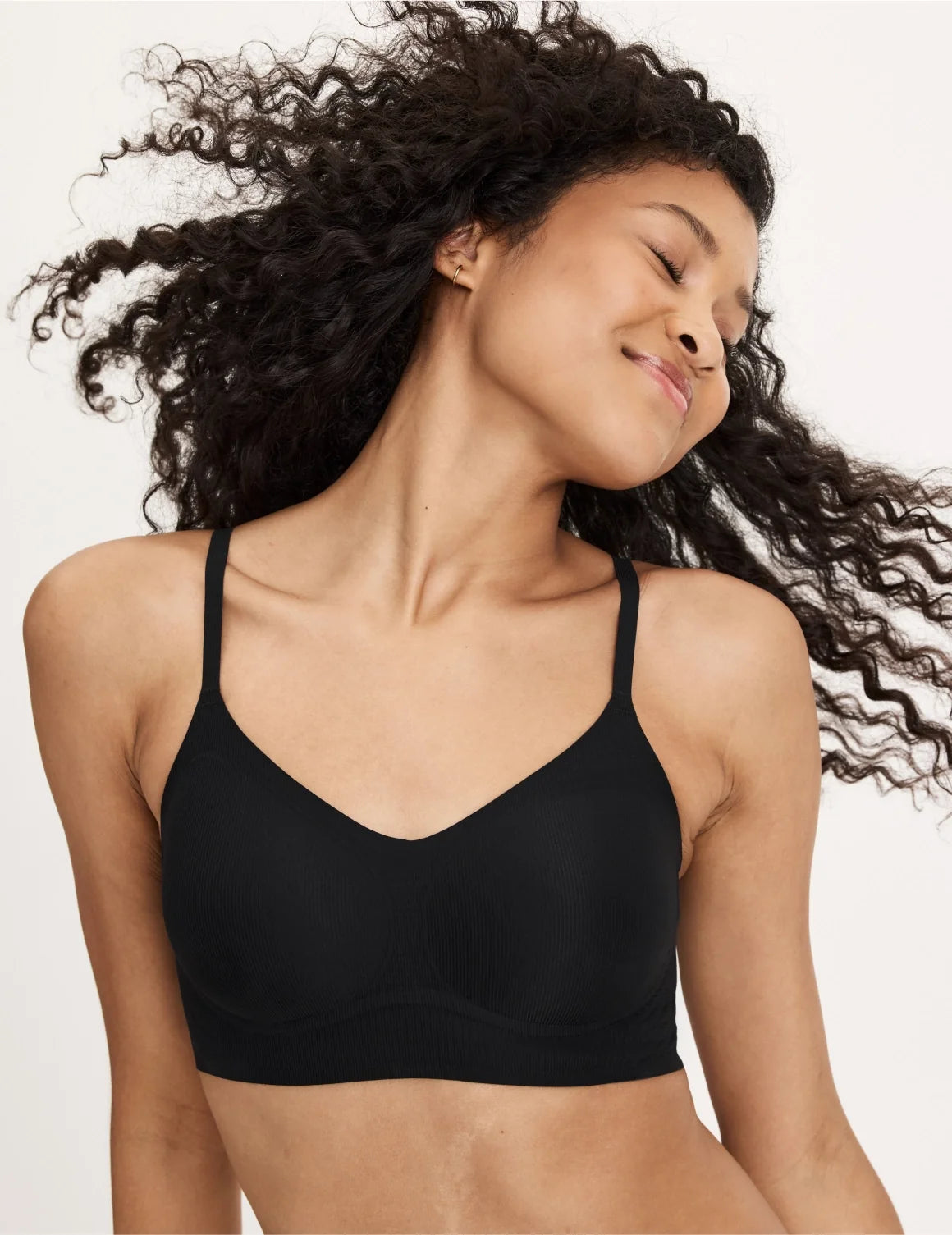 Front view of model wearing the Teen On-The-Daily Bra, highlighting the neckline, pullover design, and silhouette – Black – view 8 of 16