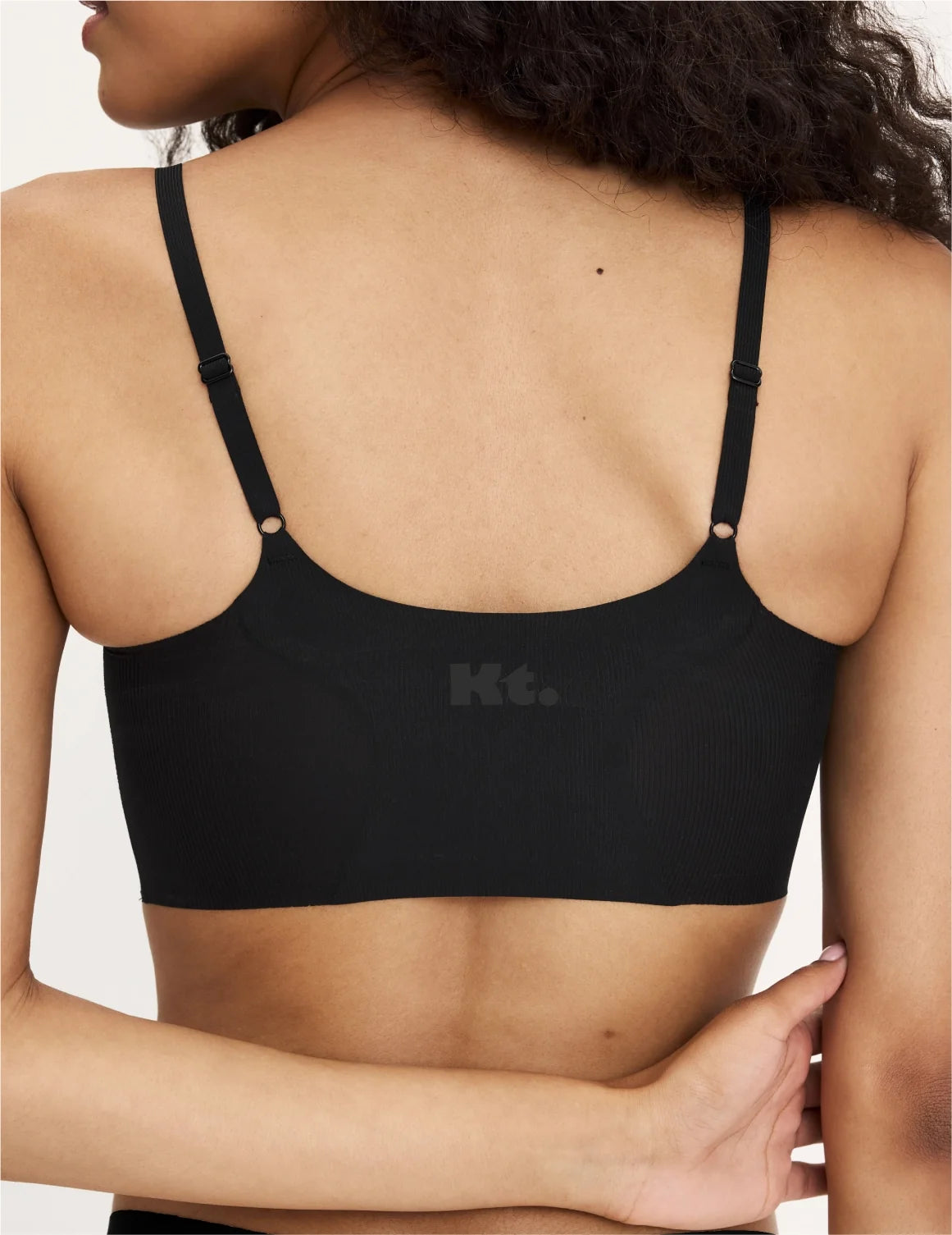 Back view of model wearing the Teen On-The-Daily Bra, highlighting the neckline, pullover design, and silhouette – Black – view 4 of 16