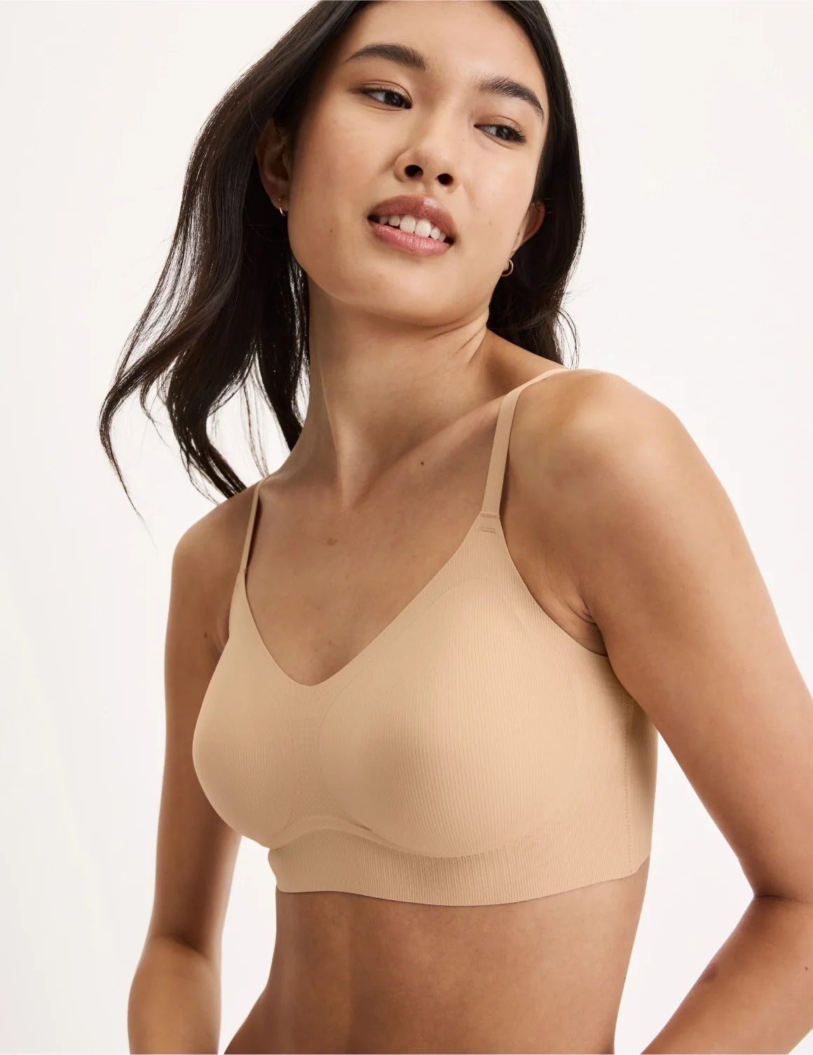 Front view of model wearing the Teen On-The-Daily Bra, highlighting the neckline, pullover design, and silhouette – Warm Sand – view 11 of 16