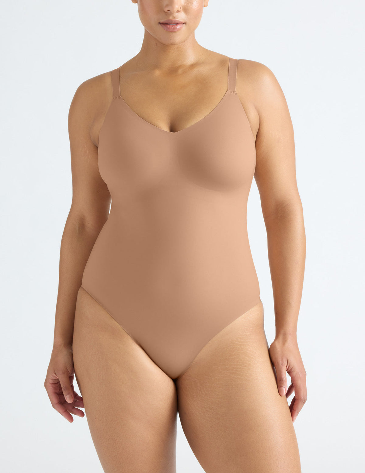 Front view of model wearing the LuxeLift Bodysuit highlighting the neckline, strap design and fit – Cavassa – view 4 of 16