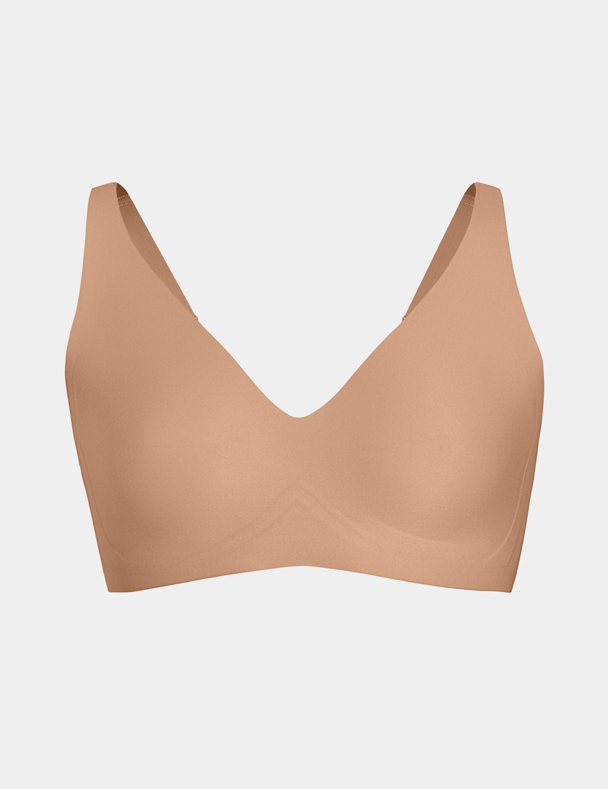 Wireless bra with a V-neckline, adjustable straps, and smooth molded cups, shown front-facing against a light gray background – Cavassa – view 9 of 50
