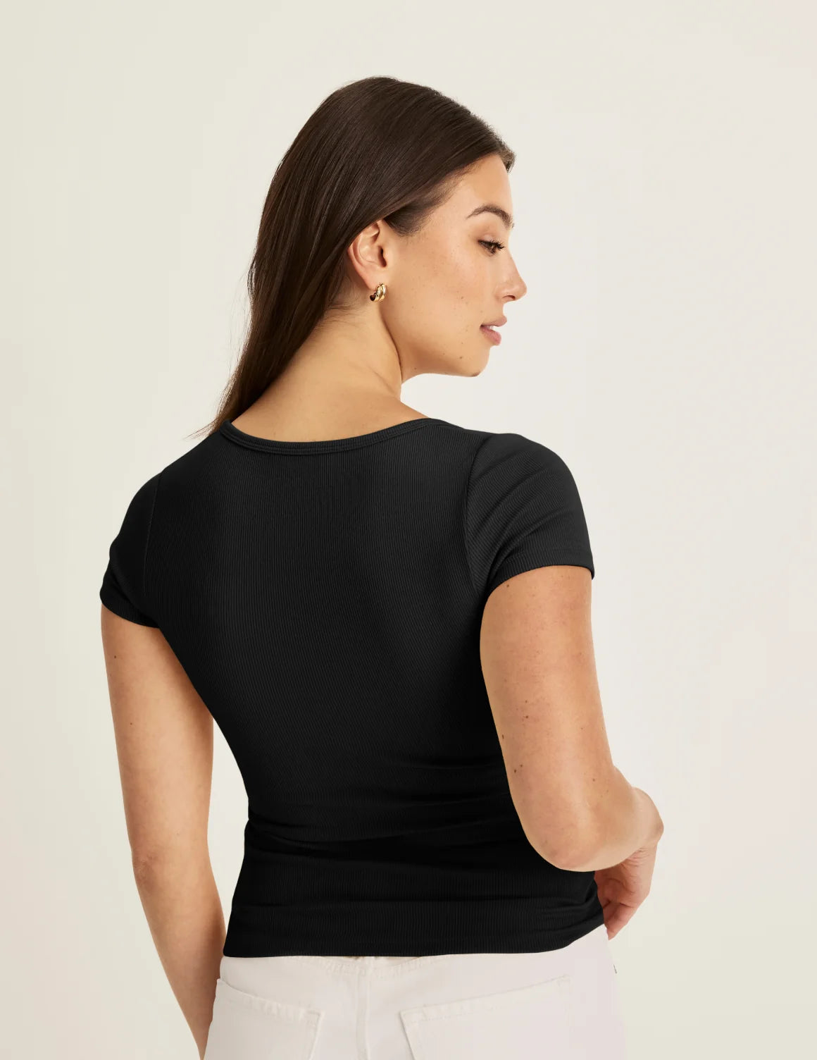 Back view of model wearing the SculptRib™ Cotton Scoop Neck T-Shirt highlighting the neckline, fabric and hugging fit – Black – view 3 of 21