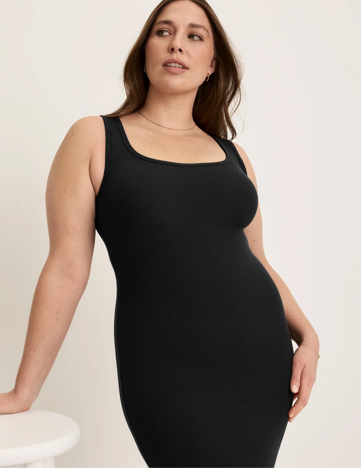 Front view of model wearing the SculptRib™ Cotton Tank Dress highlighting the neckline, hemline and hugging fit – Black – view 5 of 19
