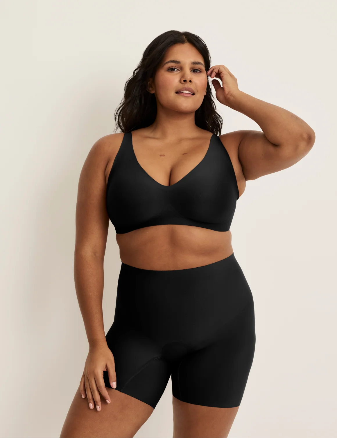 Full-body view of model wearing the Leakproof Contour Thigh Saver® 6”, highlighting the coverage and smooth fit – Black – view 8 of 19
