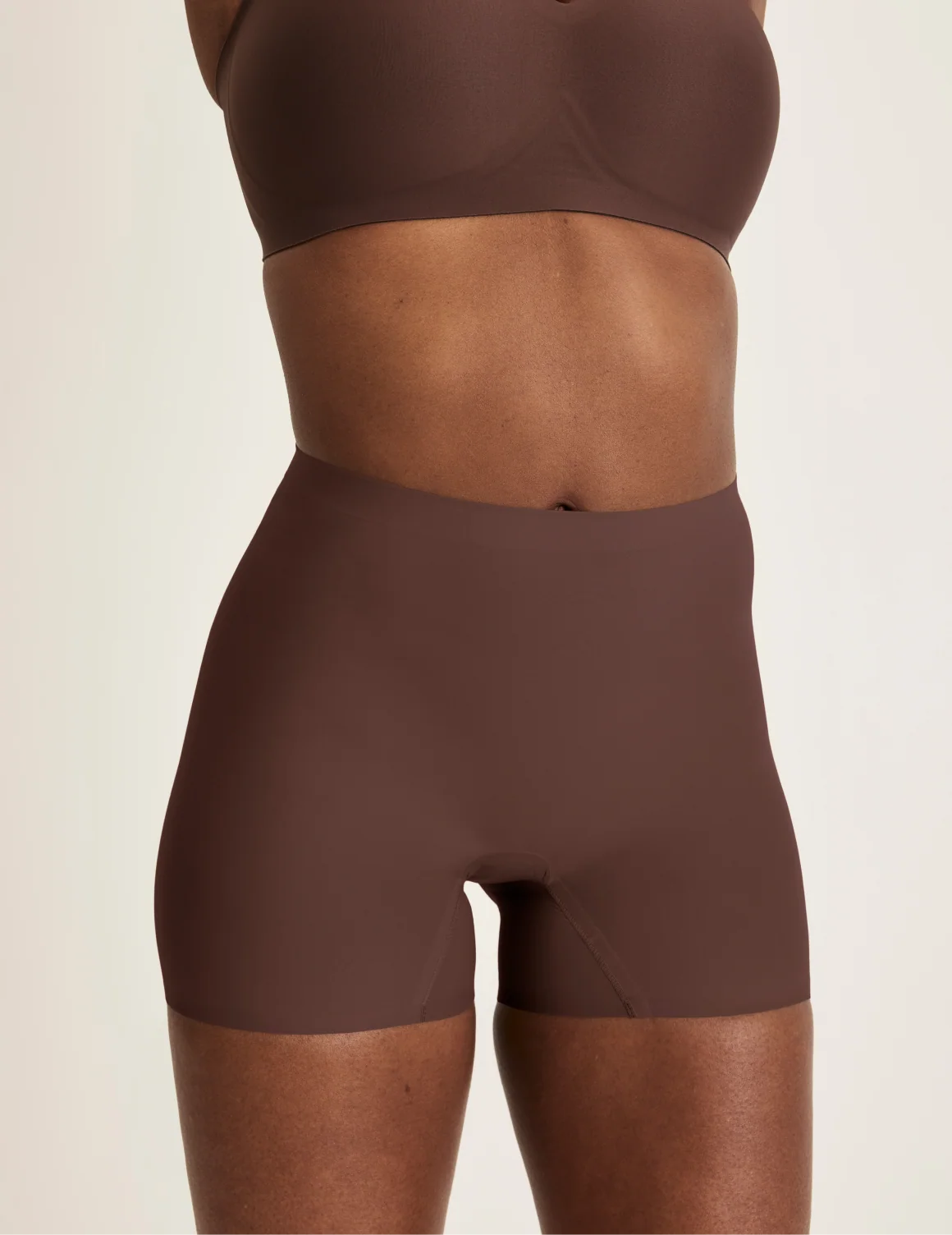 Front view of model wearing the Shortie Thigh Saver® 4”, highlighting the coverage and smooth fit – Sable – view 6 of 25