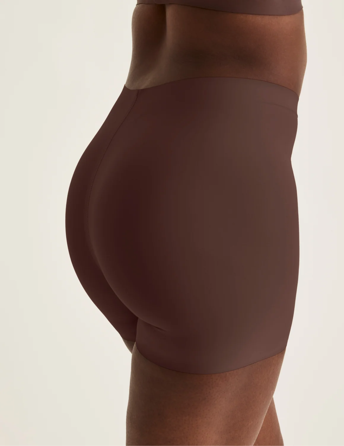 Back view of model wearing the Shortie Thigh Saver® 4”, highlighting the coverage and smooth fit – Sable – view 7 of 25