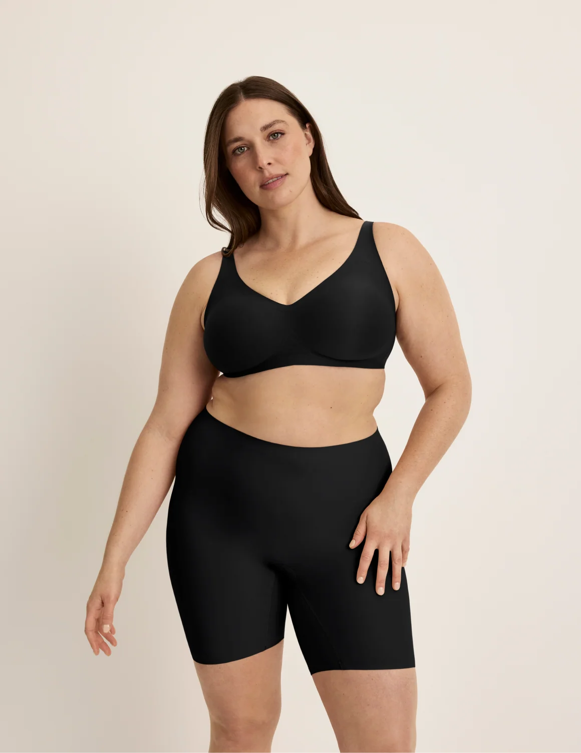 Full-body view of model wearing the Thigh Saver® 6” highlighting the coverage and smooth fit – Black – view 5 of 33