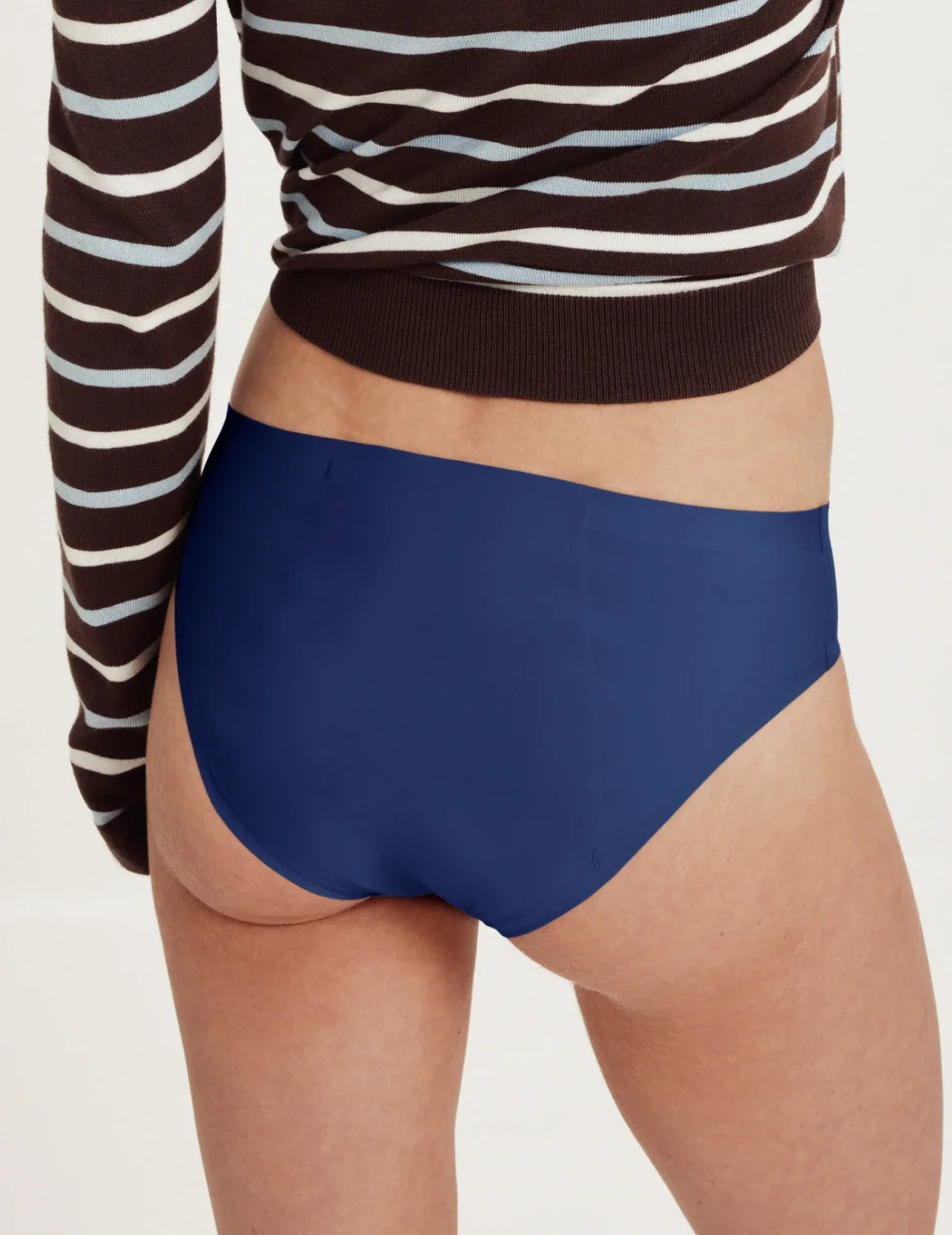 Back view of model wearing the Teen SuperPlus Leakproof® No-Show Bikini highlighting the coverage and smooth fit – Night Sky – view 12 of 16