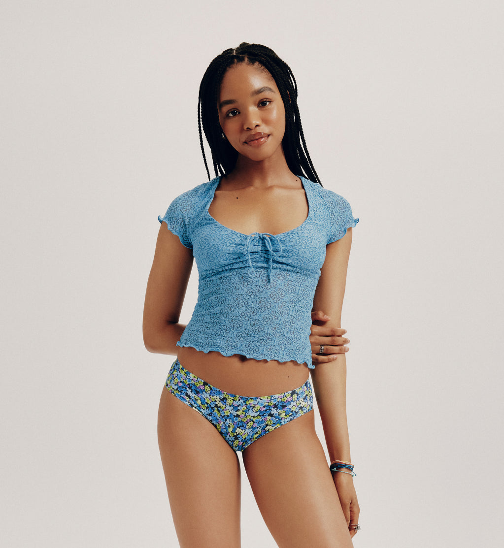 Front view of model wearing the Teen Light Leakproof No-Show Bikini highlighting the coverage and smooth fit – Electric Petals – view 5 of 67