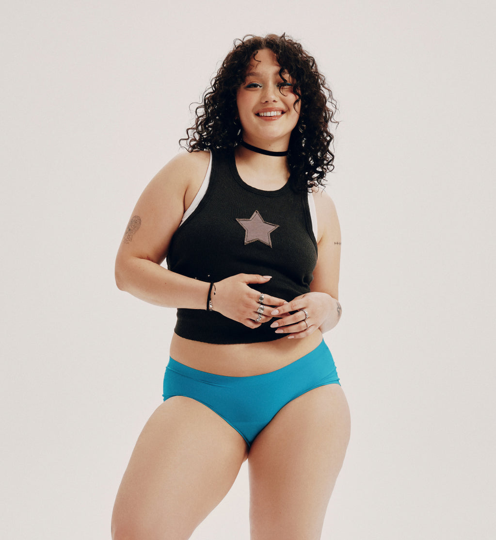 Front view of model wearing the Teen Light Leakproof No-Show Boyshort highlighting the coverage and smooth fit – Poolside – view 2 of 93