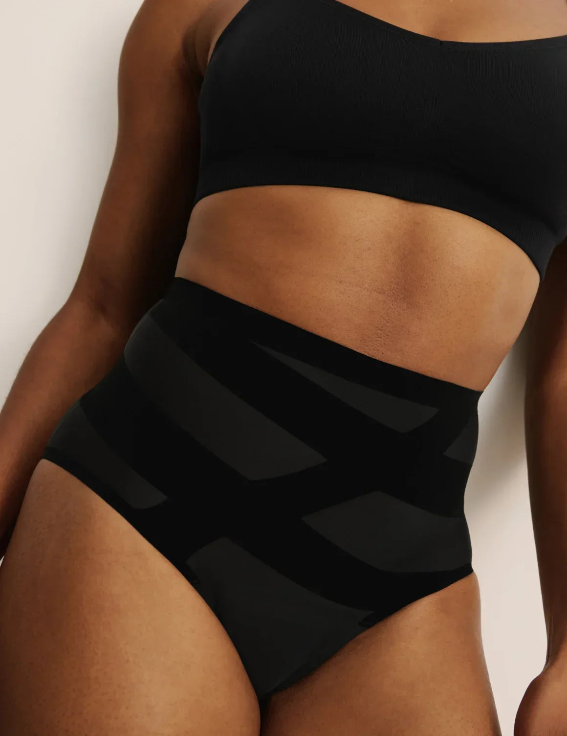 Front view of model wearing the Leakproof CoreLove High Rise, highlighting the coverage and hugging fit – Black – view 1 of 8