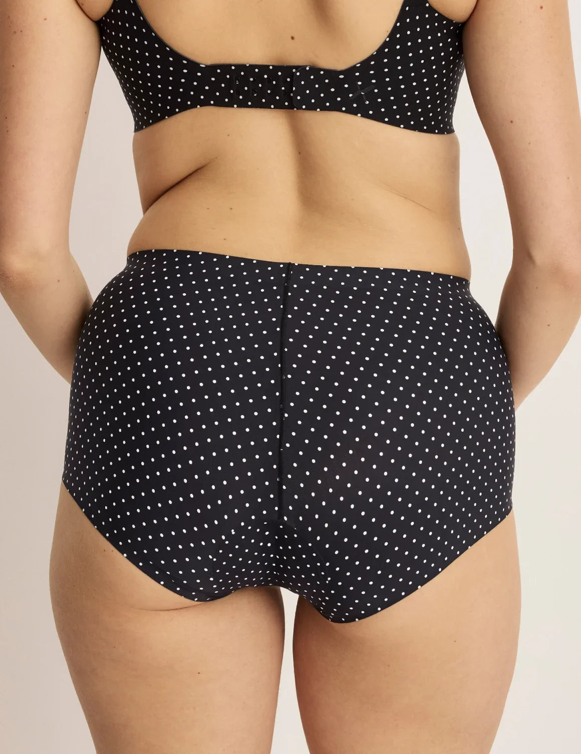 Back view of model wearing the Leakproof UltraThin No-Show Boybrief highlighting the coverage and smooth fit – Black with White Polka Dot – view 9 of 12
