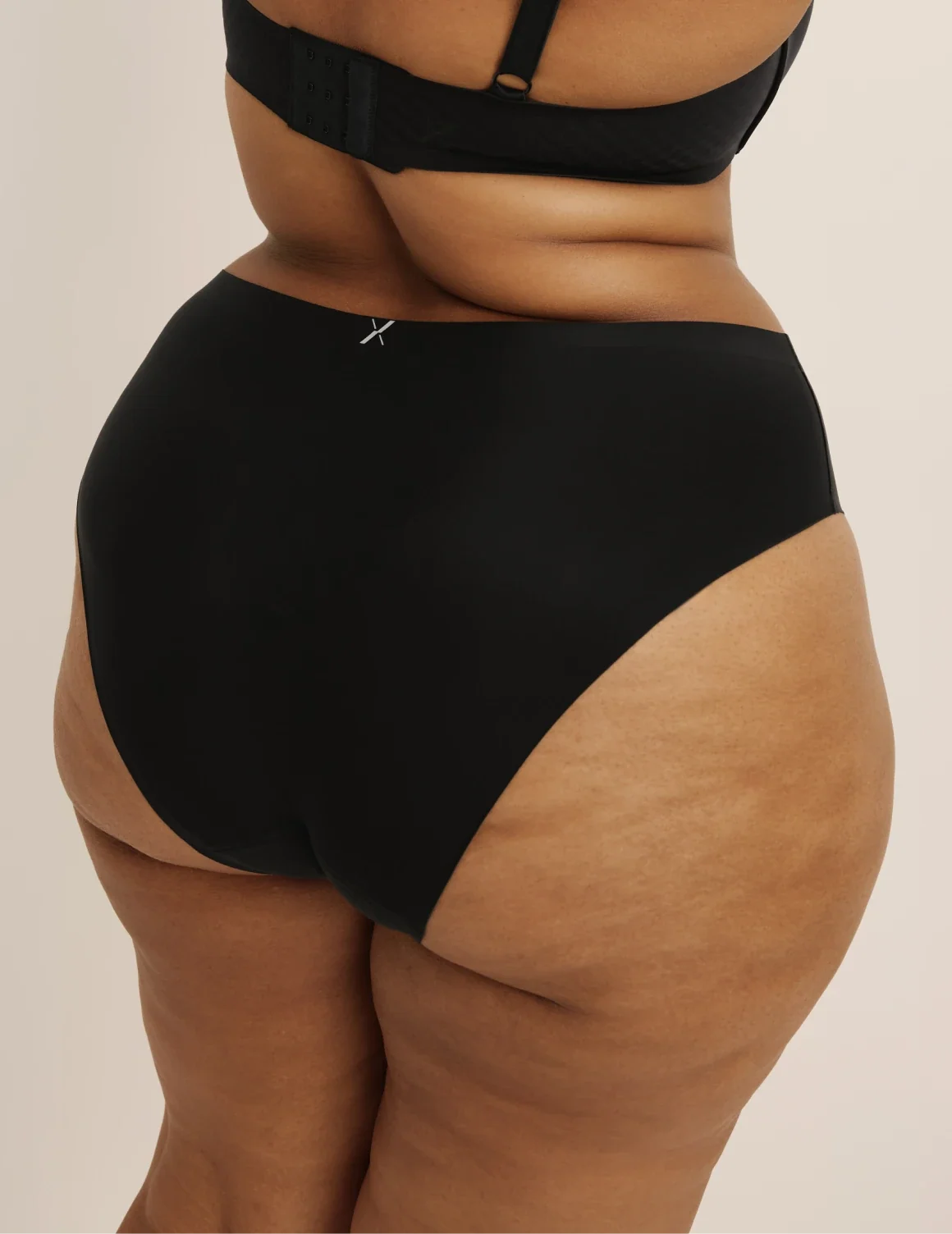 Back view of model wearing the Leakproof UltraThin No-Show French Cut highlighting the coverage and smooth fit – Black – view 4 of 36
