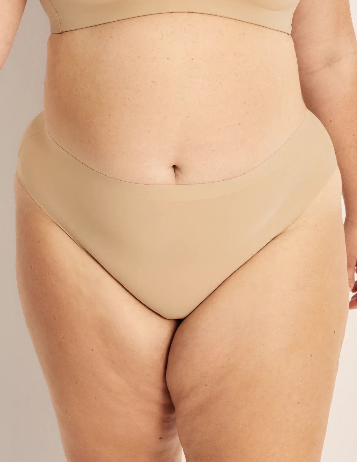 Front view of model wearing the Leakproof UltraThin No-Show French Cut highlighting the coverage and smooth fit – Warm Sand – view 10 of 36