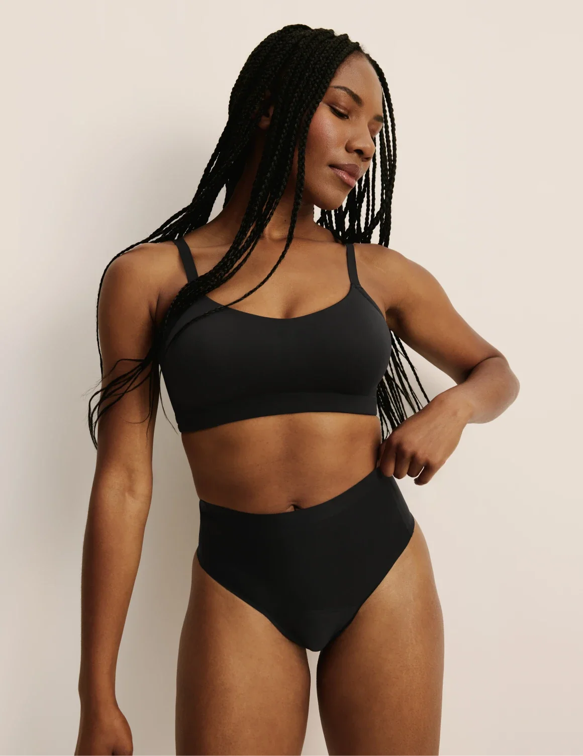 Full-body view of model wearing the Light Leakproof No-Show High Rise Thong highlighting the coverage and smooth fit – Black – view 4 of 9