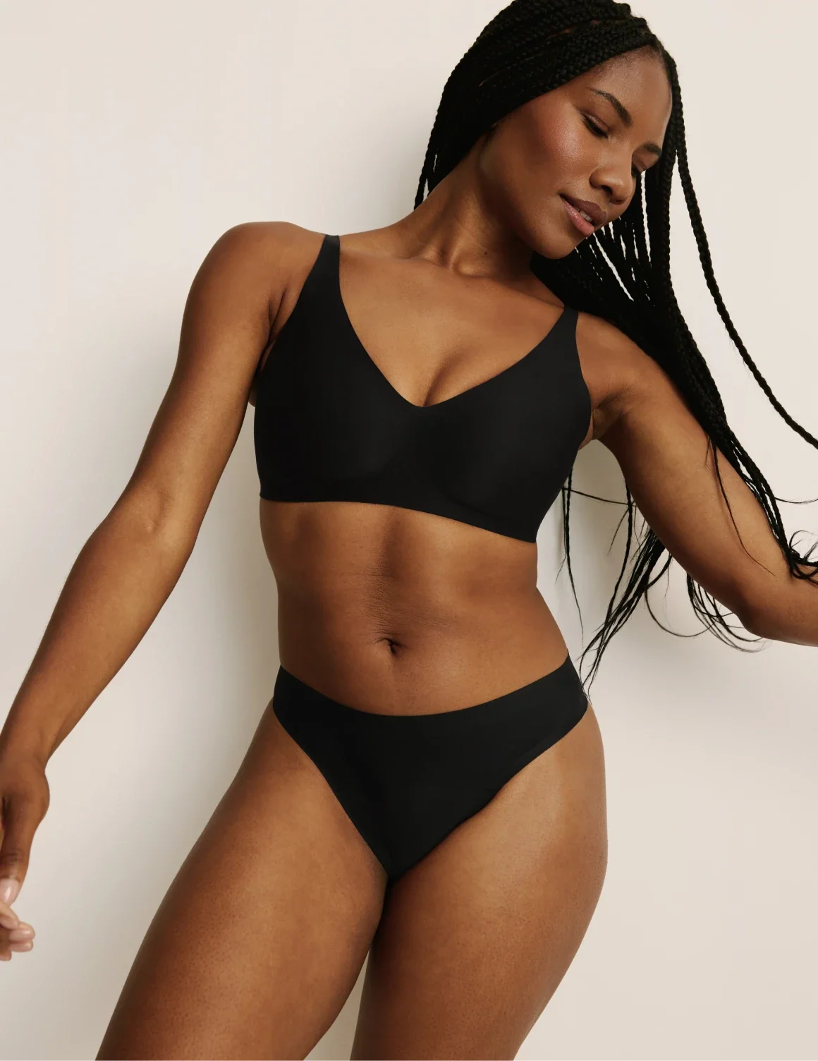Full-body view of model wearing the Light Leakproof UltraThin No-Show Thong highlighting the coverage and smooth fit – Black – view 12 of 40