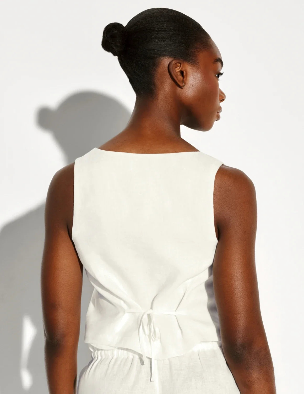 Back view of model wearing the Linen Poolside Tank highlighting the coverage and fit – Ivory – view 11 of 13