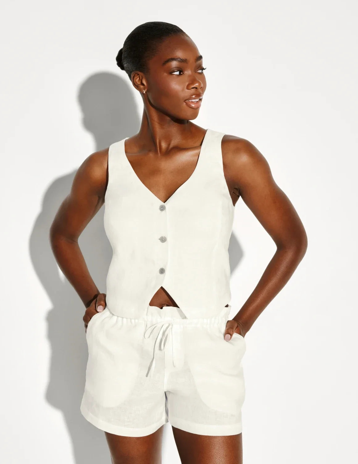 Front view of model wearing the Linen Poolside Tank highlighting the coverage and fit – Ivory – view 12 of 13