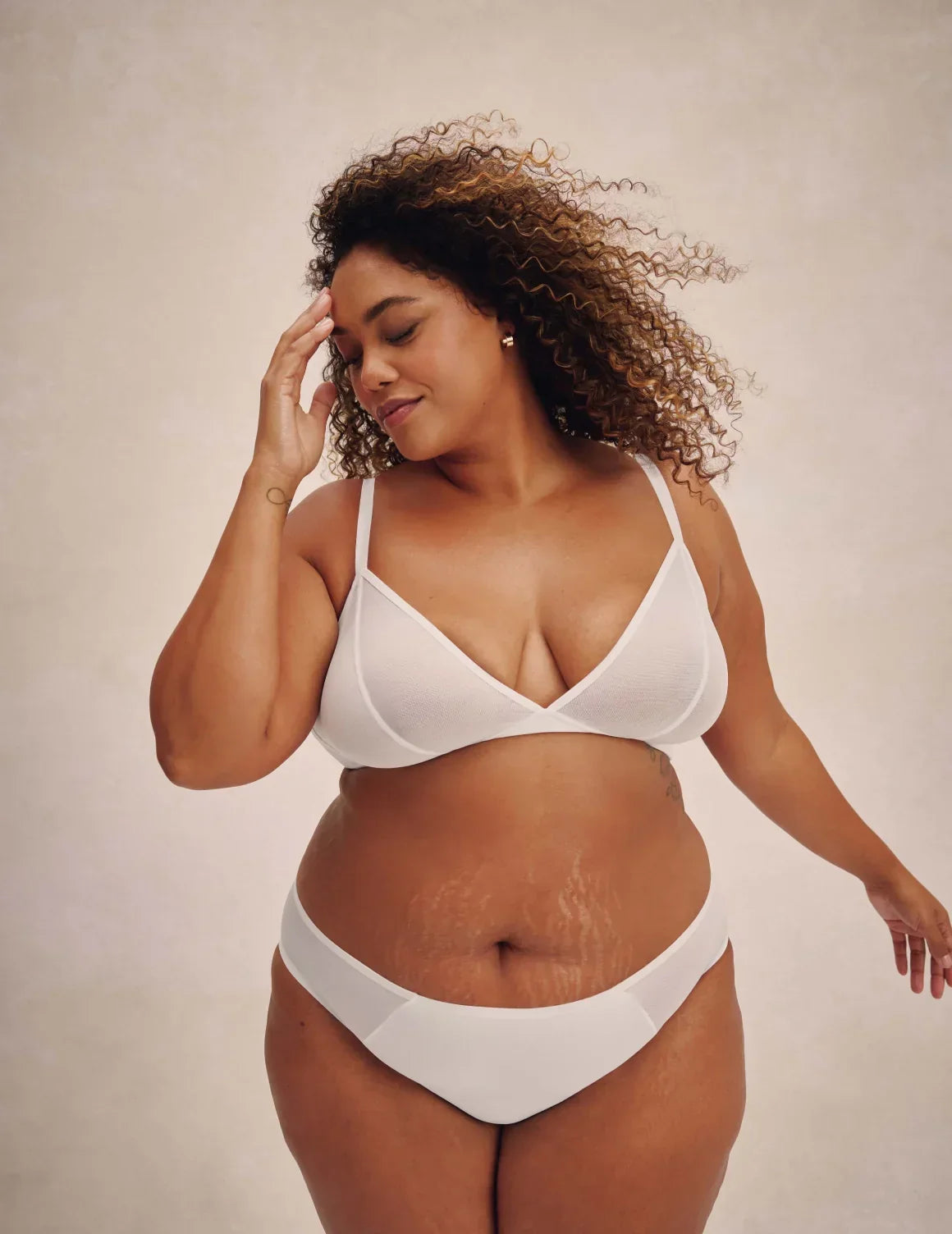 Full-body view of model wearing the Mesh Deep V Bra, highlighting the neckline, strap design, and smooth silhouette – White – view 5 of 42