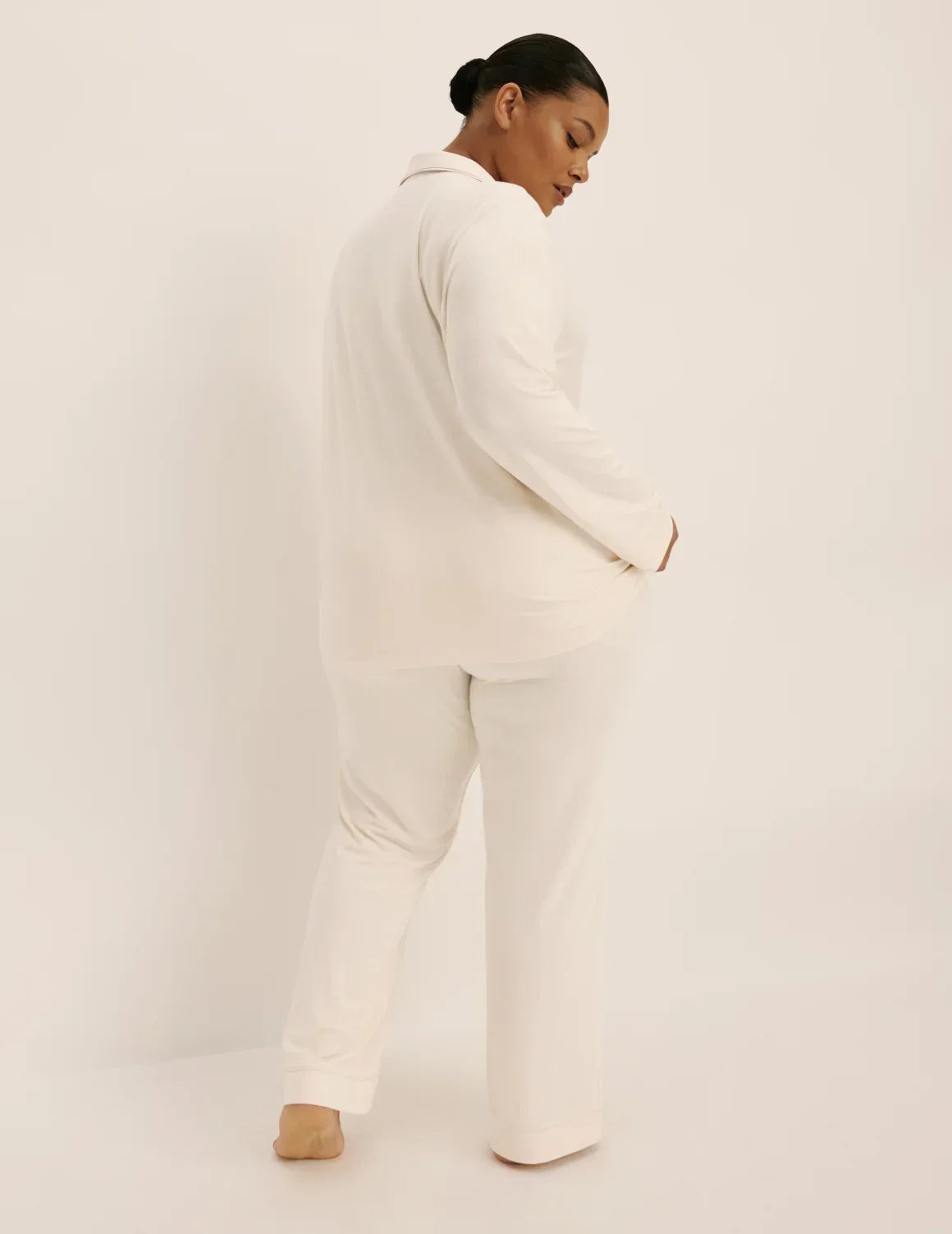 Back view of model wearing The Quintessential Sleep Set highlighting the coverage and fit – Ivory – view 9 of 44