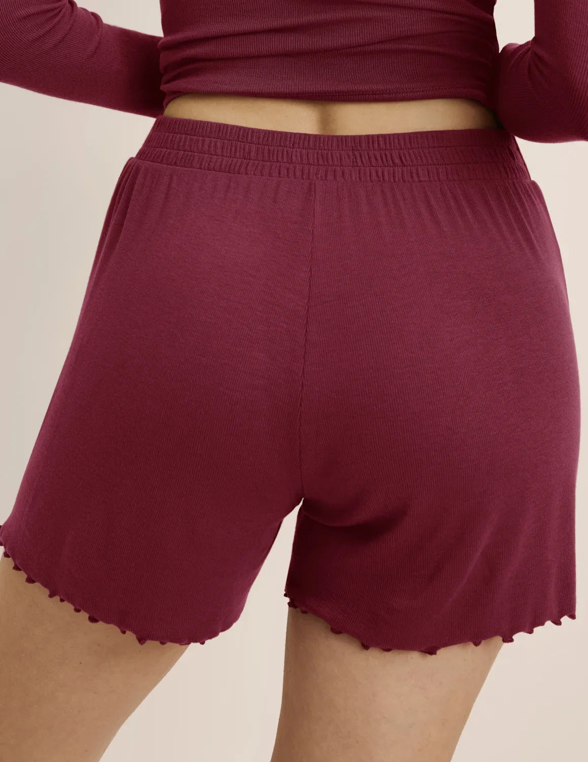 Back view of model wearing the Modal Rib Short highlighting the coverage and fit – Dark Cherry – view 8 of 16