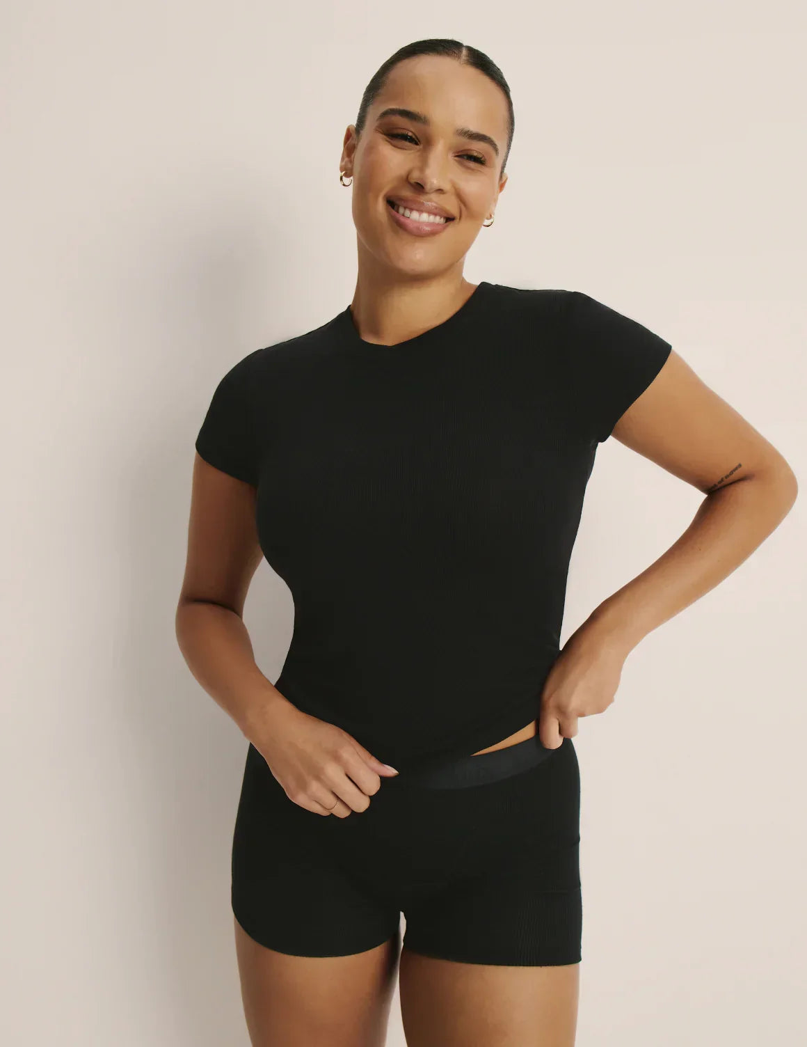 Front view of model wearing the Modal Rib T-Shirt highlighting the coverage and fit – Black – view 1 of 48